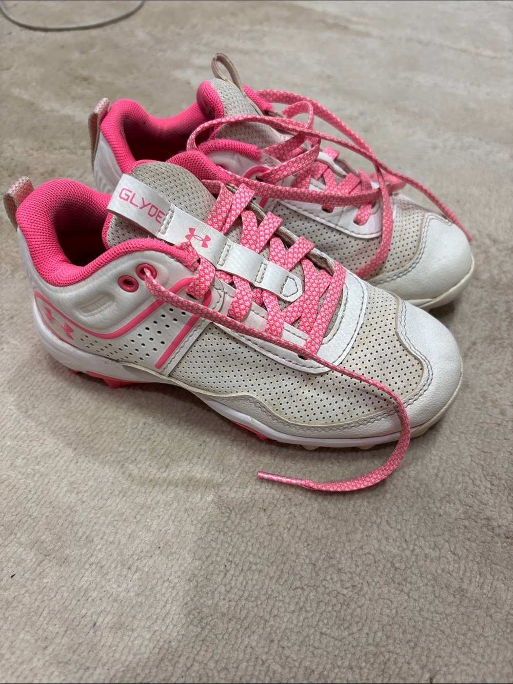 Under Armour Kids cleats in White and Pink